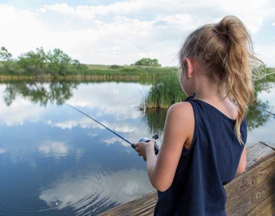 Girl fishing at Rocky Mountain Arsenal National Wildlife Refuge
