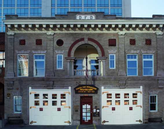 Exterior view of the vintage brick Denver Firefighters Museum with the old garage doors