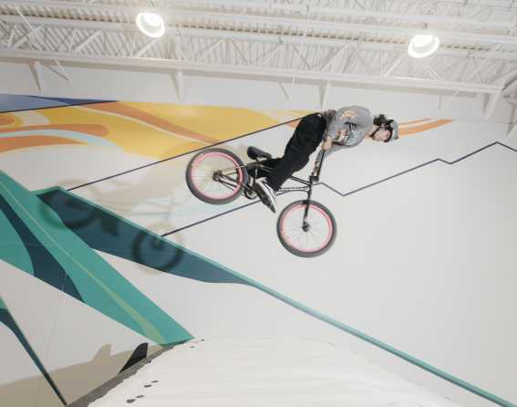 A child flying high on a BMX bike at Snobahn Action Sports Center.