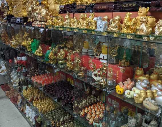 Shelves of Asian figurines at Truong An Gifts in Denver, Colorado.