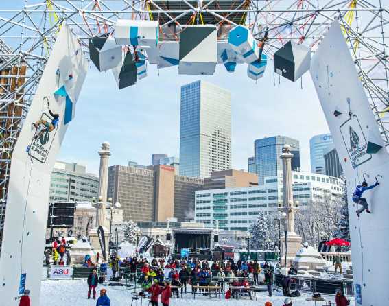 Climbers scale the course in downtown Denver at the UIAA Ice Climbing 2019