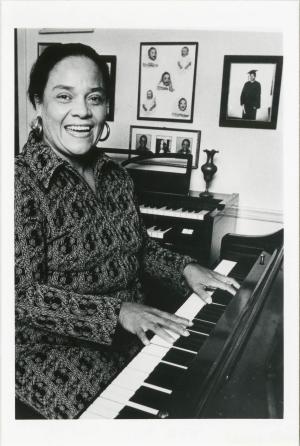 black and white photo of Ernie Mae Miller playing the piano