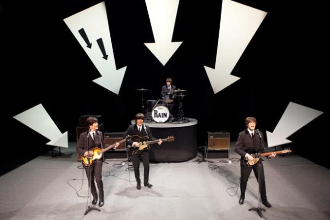 Rain, the Beatles Tribute Band performs on stage as the Beatles of the early 1960s