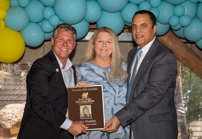 Robin Madden, owner of Islander Properties, receiving the Tourism Hall of Fame Award from the Punta Gorda/Englewood Beach VCB on May 9, 2025