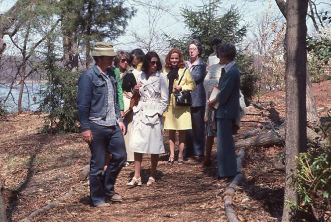 Horticulturalist Tony Dove shows guests around the Garden in 1977.