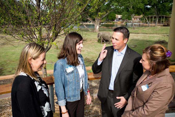 Meeting planners gather in front of the elephant display at the Sedgwick County Zoo in Wichita, Kansas