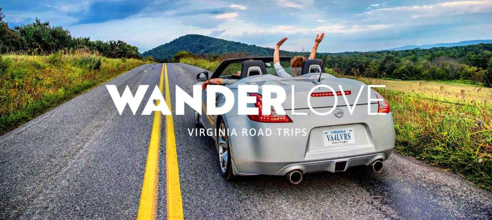 WANDERLove Virginia Road Trips banner of person with their hands in the air while sitting in a convertible driving down a road