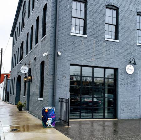 gray brick building with libbys southern comfort sign in covington ky