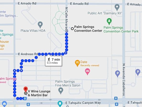 A map showing a walking route in Palm Springs from 'V Wine Lounge & Martini Bar' to a location marked 'Date Recently viewed' with blue dots indicating the path, estimated to take 7 minutes covering 0.3 miles. Nearby landmarks include the Palm Springs Convention Center and Palm Springs Fine Men's Salon.