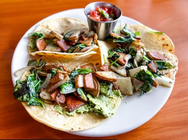 A plate of soft shell tacos