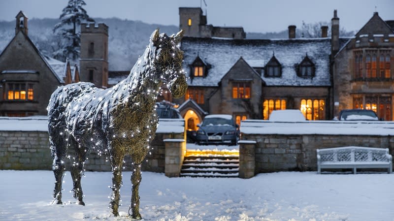 Ellenborough Park glows with lights, surrounded by a blanket of snow