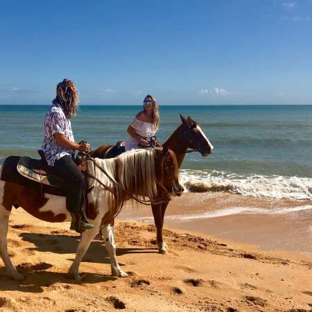 Two People Riding Horses On Flagler Beach