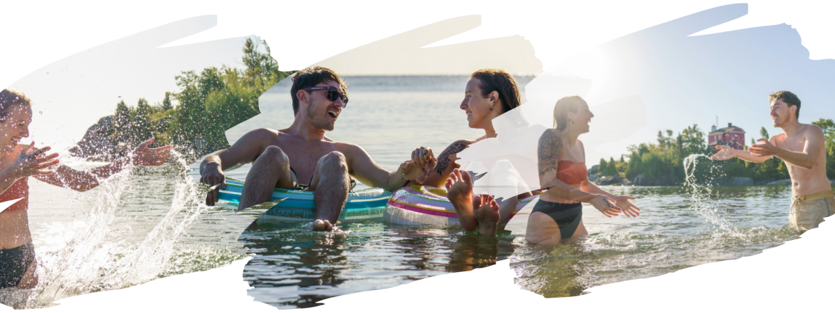 A couple splashing and floating in Lake Superior at McCarty's Cove