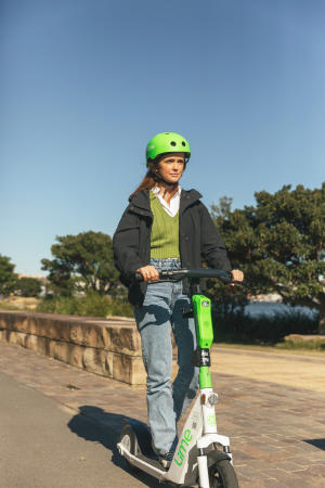 Person on a Lime electric Scooter