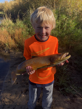 boy holding big trout