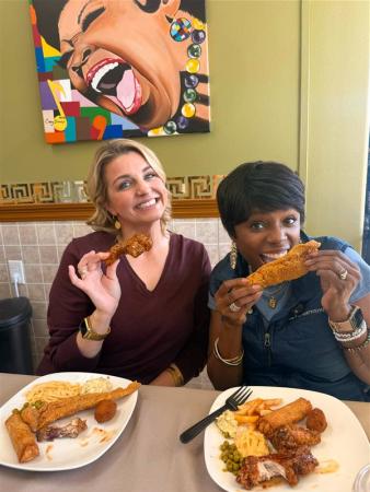 Podcast hosts Katie Guasco and Zondra White Jones try the fried fish, egg rolls and sides at Creole Sisters Cafe and Catering.