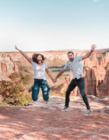 Couple Jumping Excitedly on Colorado National Monument
