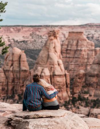 Couple Posing in Front of Colorado National Monument