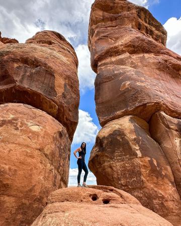 Person Standing in Devil's Kitchen Rock Formation