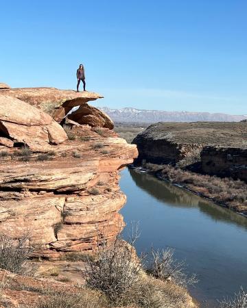 Woman Standing on Rock over the Colorado River