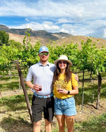 Two People Posing at a Winery