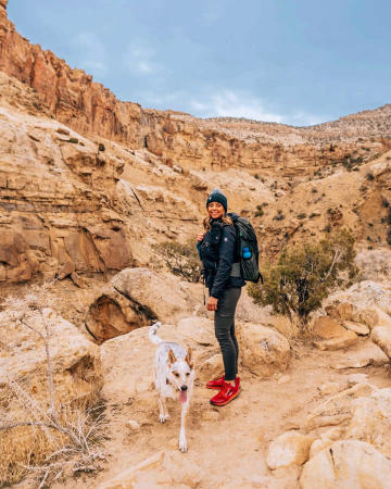 Woman and Dog Hiking in the Winter