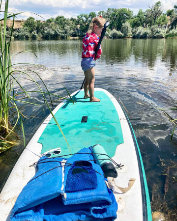 Kid on Paddleboard on a Lake