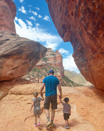 Dad walking with two kids