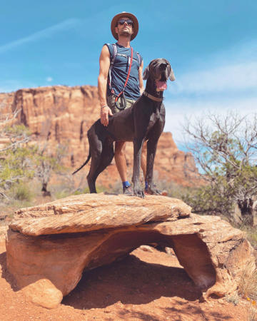 Man and Dog on a Rock outside of Devil's Canyon