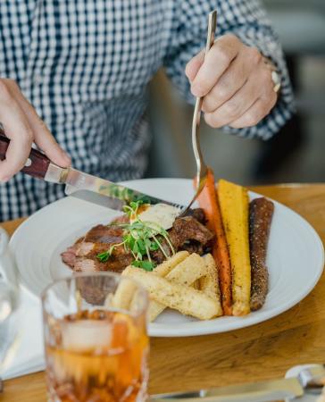 Person Cutting Food at Devil's Kitchen