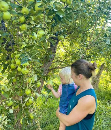 Mom and Daughter Picking Apples