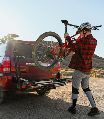 Person Using Quickrstuff's Bike Rack