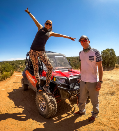 A couple posing on an ATV