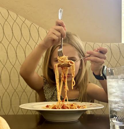 Kid Eating Spaghetti at Enzo's Ristorante