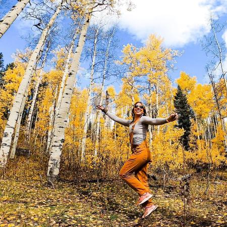 Woman Strolling Through Aspen Trees on Grand Mesa