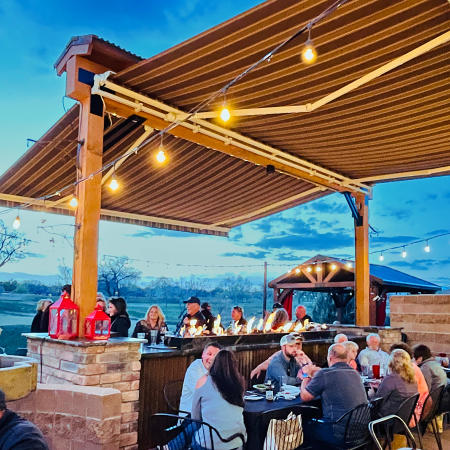 People Dining on the Patio of Enzo's in Winter