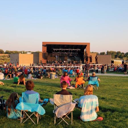Crowd enjoying show at the Amphitheater at Las Colonias