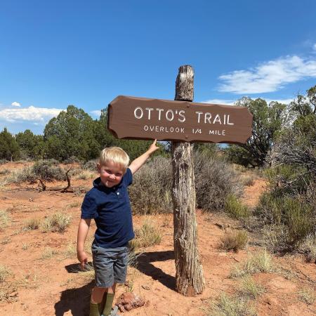 Boy Pointing to Otto's Trail Sign