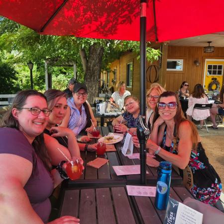 a group of women enjoying a wine tasting at Vines 79 Vine