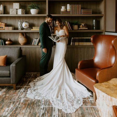 Recently Married Couple Posting in Hotel Maverick's Lobby