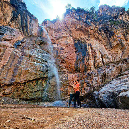 Two Women Under a Waterfall