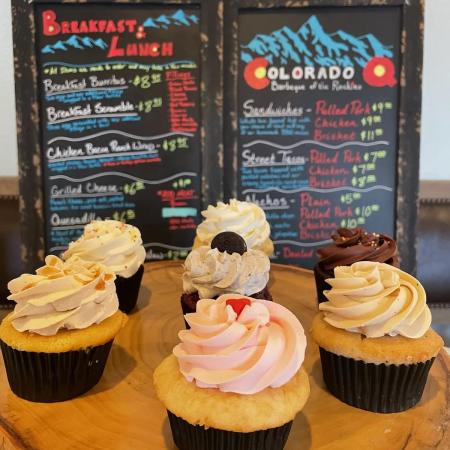 Cupcakes from The Baker's Boutique in front of the Colorado Q Sign