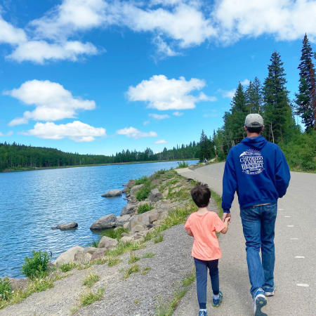 Father and Son walking next to Lost Lake on the Grand Mesa