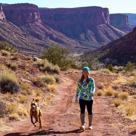 Woman and dog hiking trail