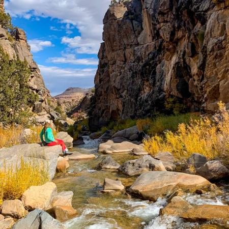Woman Sitting Next to a Creek in Dominguez-Escalante NCA
