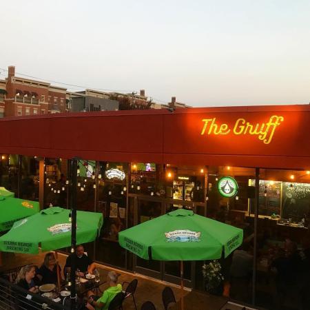 The Gruff restaurant and patio with green umbrellas in Covington, KY
