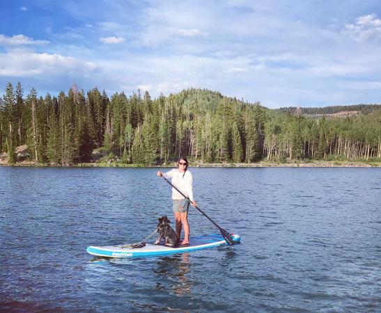 Woman and Dog on a Paddleboard on the Grand Mesa