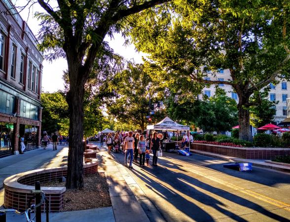 People walking down Main Street at Market on Main