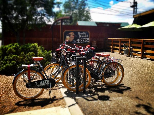 Bicycles sit outside as part of the Routes Bicycle Tours and Rentals bike tour