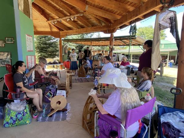 Experts provide a demonstration at a Heart of New Mexico Fiber and Art Gathering event